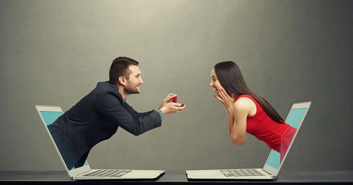 Conceptual illustration of a couple communicating through separate laptop screens